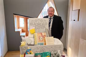 Angus MP Graeme Dey is delighted with the latest version of Scotland’s much cherished Baby Box.