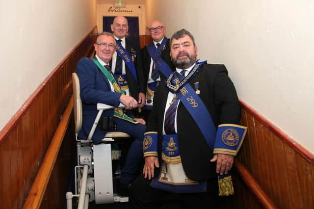 Pictured with the new stairlift are Wullie Bisset, Michael Ford, Graham Letford and Wullie Ford. (Wallace Ferrier)