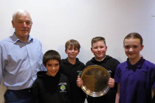 Rotary Club president David Stobbs is pictured with the winning team from Langlands Primary School.