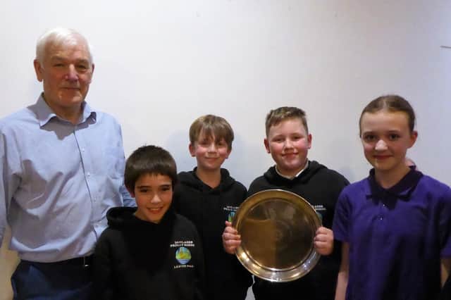 ​Rotary Club president David Stobbs is pictured with the winning team from Langlands Primary School.