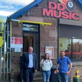 Graeme Dey is pictured with DD8 Music staff during his visit.