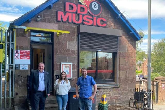Graeme Dey is pictured with DD8 Music staff during his visit.