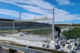 Forfar fans were amongst those pitching in to clear Station Park ahead of Saturday's win over Kelty Hearts. Pic by Louise Taylor