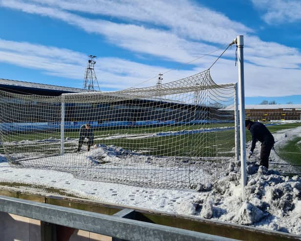 Forfar fans were amongst those pitching in to clear Station Park ahead of Saturday's win over Kelty Hearts. Pic by Louise Taylor