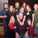 Ian (seated) is pictured with his wife Beverley, son James and his wife, daughter Krysta and her husband and grandchildren. (Wallace Ferrier)
