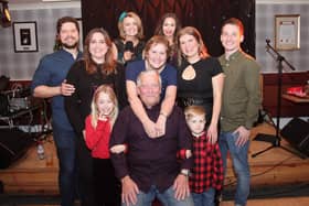 Ian (seated) is pictured with his wife Beverley, son James and his wife, daughter Krysta and her husband and grandchildren. (Wallace Ferrier)