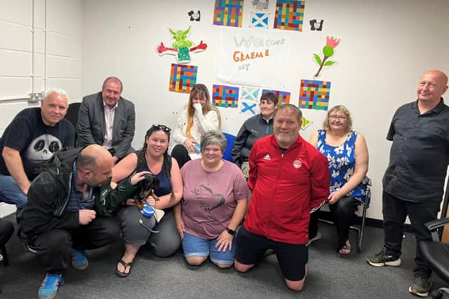 Angus South MSP Graeme Dey is pictured with Richmond Fellowship staff and some of those who use the organisation’s services.