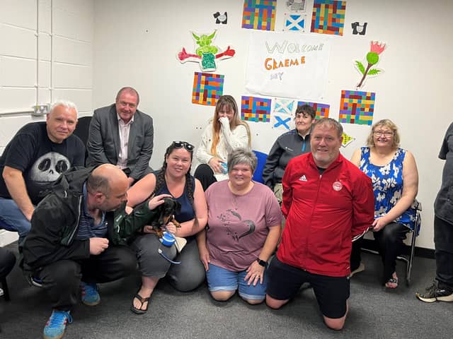 ​Angus South MSP Graeme Dey is pictured with Richmond Fellowship staff and some of those who use the organisation’s services.