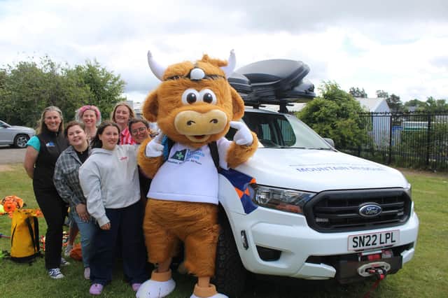 Pictured at the competition's launch are: (back, l-r) mountain rescue team member Deirdre Matthew, project co-ordinator Victoria Simpson, Andie Sewing School director Gillian McIver; (front l-r) Kirsten Wallace, UNESCO City of Design Dundee Project co-ordinator; Andie Sewing School student Zoe and sewing teacher Hannah Watson with Hamish the Highland Coo.