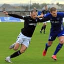 Montrose forward Craig Johnston battles for possession during Saturday's draw