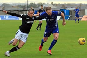 Montrose forward Craig Johnston battles for possession during Saturday's draw