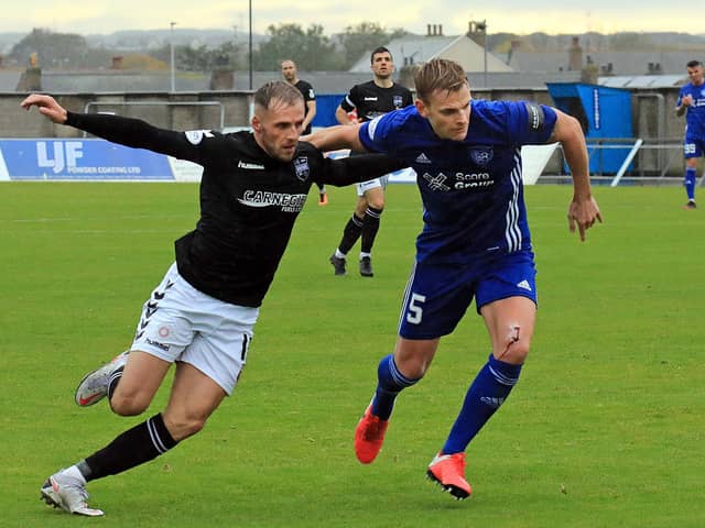 Montrose forward Craig Johnston battles for possession during Saturday's draw