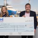 ​Laura Forsyth accepts the £20,000 cheque from Montrose Port Authority CEO Tom Hutchison. (Pic: Jonathan Addie)