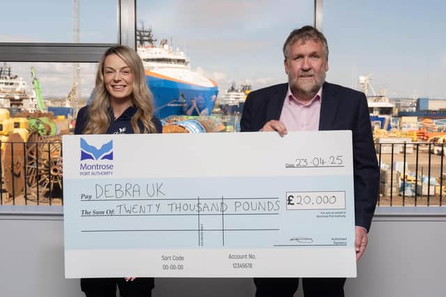 Laura Forsyth accepts the £20,000 cheque from Montrose Port Authority CEO Tom Hutchison. (Pic: Jonathan Addie)
