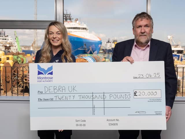 ​Laura Forsyth accepts the £20,000 cheque from Montrose Port Authority CEO Tom Hutchison. (Pic: Jonathan Addie)