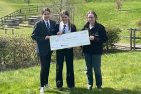 ​Carla and Willow are pictured presenting their £3000 cheque to Murton Trust manager Alison Elliott.