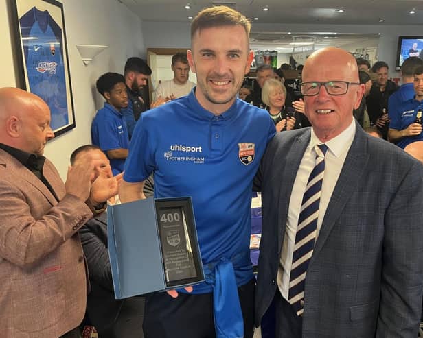 ​Graham Webster is presented with his trophy by Montrose chairman John Crawford (pic: MFC)