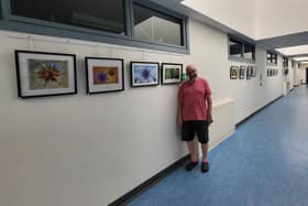 ​Ian Bain with some of his work, which is being exhibited at Whitehills Community Hospital.