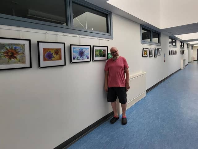 ​Ian Bain with some of his work, which is being exhibited at Whitehills Community Hospital.