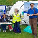 Rotarians are pictured with a ShelterBox and tent on their stand at last year’s Farmers' Market in Victoria Park.