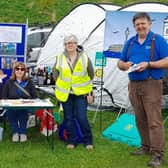 Rotarians are pictured with a ShelterBox and tent on their stand at last year’s Farmers' Market in Victoria Park.