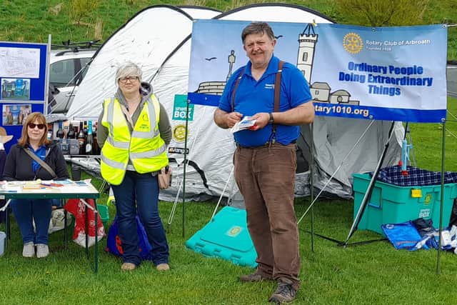 Rotarians are pictured with a ShelterBox and tent on their stand at last year’s Farmers' Market in Victoria Park.