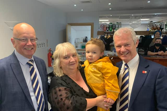 John Crawford, left), together with chief executive Peter Stuart, who presented Anne and grandson Alan with a thank you gift.