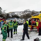 The "highly dramatic" multi-agency rescue was launched on Friday to free a landworker who had become trapped under the root plate of a large tree. The man is now recovering at home.
