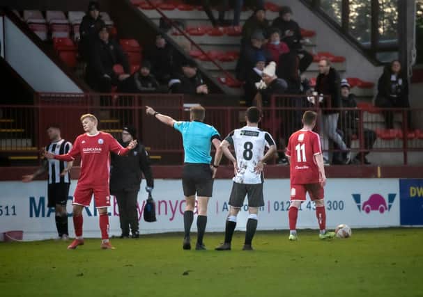 Max Kucheriavyi is sent for an early bath during Monday's match. Pic by Graeme Youngson
