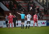 Max Kucheriavyi is sent for an early bath during Monday's match. Pic by Graeme Youngson