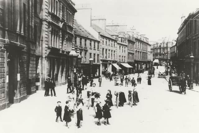 Although there is a motor vehicle in this undated picture of Arbroath High Street, the number of people wandering about the carriageway almost gives the impression of a pedestrian precinct.