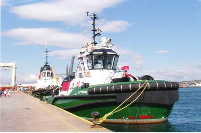 The festively liveried Tug Kittiwake of Targe Towing, berthed at the South Quay.