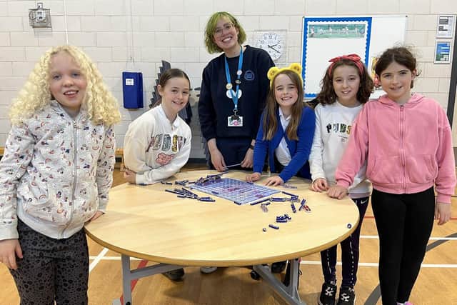 The Angus Engineering initiative recently visited Muirfield Primary School in Arbroath. Picutred are some of the P5 pupils who took part, with Rachel Gordon from Dundee Science Centre.
