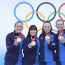 Curlers Milli Smith, Hailey Duff, Jennifer Dodds, Vicky Wright and Eve Muirhead of Team Great Britain pose for pictures with their gold medals after winning the Women's Curling final against Team Japan at National Aquatics Centre in Beijing, China. Photo by Lintao Zhang/Getty Images