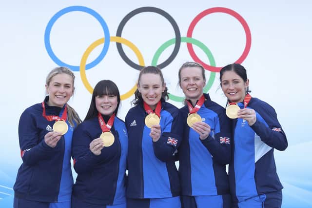 Curlers Milli Smith, Hailey Duff, Jennifer Dodds, Vicky Wright and Eve Muirhead of Team Great Britain pose for pictures with their gold medals after winning the Women's Curling final against Team Japan at National Aquatics Centre in Beijing, China. Photo by Lintao Zhang/Getty Images