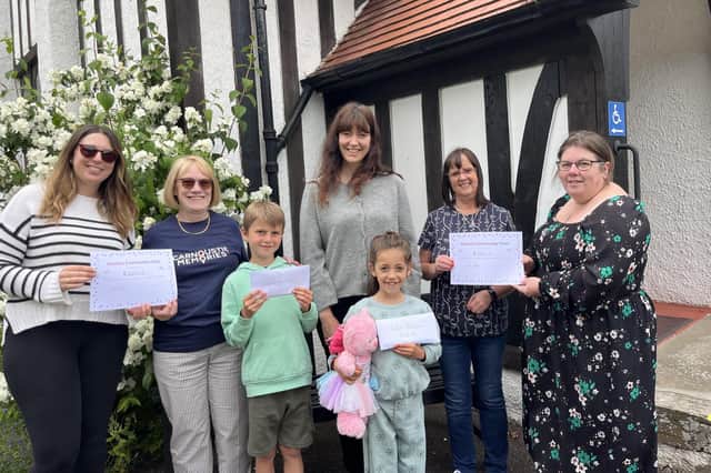 Pictured (l-r) are: Alice Thomas(choir treasurer) Lorraine Young, choir members Flynn, Laura and Sophie, Lindsey Le Grice and Catherine Black.