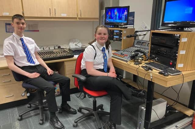 Presenters Eva Hutcheon, S3, and Lewis Fyfe S6, at the sound desks.
