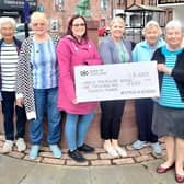 ​Some of the WRI members are pictured with their cheque.