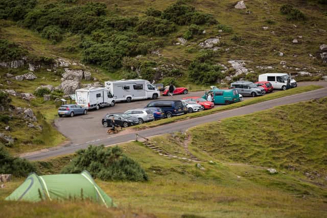 Car parks and beauty spots along the A838 on the North Coast 500 route near Ullapool fill up in summer 2020 as some lockdown rules were relaxed.. (Photo by Paul Campbell/Getty Images)