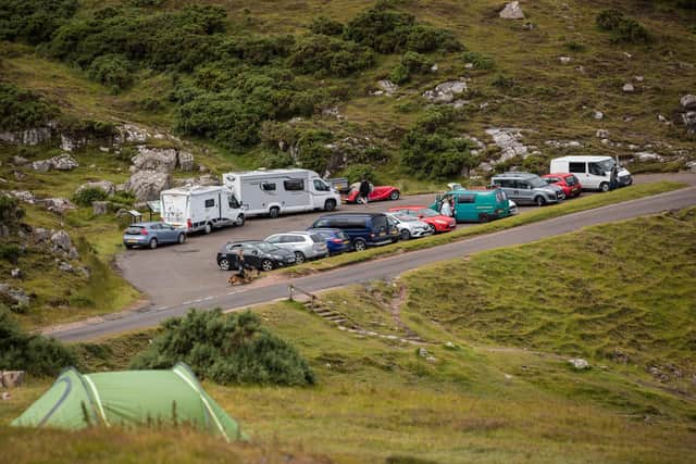 Car parks and beauty spots along the A838 on  the North Coast 500 route near Ullapool fill up in summer 2020 as some lockdown rules were relaxed.. (Photo by Paul Campbell/Getty Images)