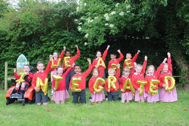 Pupils at Cairnshill Primary School celebrating after hearing the news