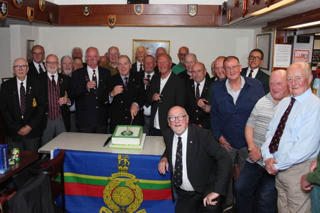 ​Col Barry Barnwell, branch president, cuts the anniversary cake. (Wallace Ferrier)