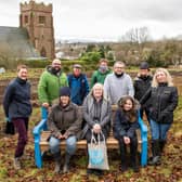 Kirriemuir Community Garden volunteers are pictured receiving a beautiful bench from representatives from the Roods Co-op. (Andy Thompson)