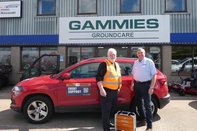 Jim Beattie, Tayside 4x4 Response chairman and volunteer, with Les Gammie, Depot and the Stihl PS3000 battery generator.