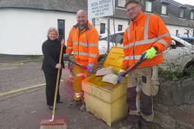 Dianne Alexander with road crew members David Scott and Allan Cleary.