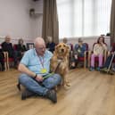 Alex Collie is pictured with therapy dog Isla at the opening of the new dementia meeting centre. (Andy Thompson)