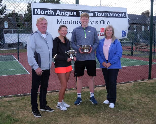 North Angus Tennis Tournament singles winners Patrick Young and Alicia Gates with their trophies handed out by tournament sponsors Doug and Sandra Cree of DC Lighting Services Ltd.