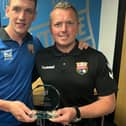 Montrose forward Martin Rennie made his 100th appearance for the club recently and is pictured receiving his trophy from director Peter Davidson.