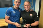 Montrose forward Martin Rennie made his 100th appearance for the club recently and is pictured receiving his trophy from director Peter Davidson.