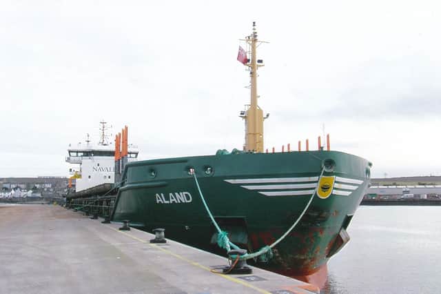 Chinese-built, Portuguese-flag Aland loaded logs at the North Quay, Montrose port.